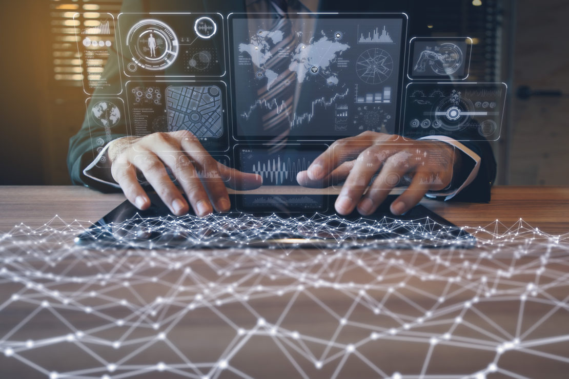 businessman using tablet PC and information communication technology concept. IoT(Internet of Things). GUI(graphical user interface). paperless office.