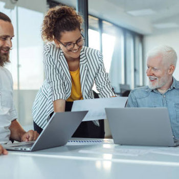 group of people around laptops