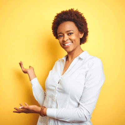 African American woman smiling in front of yellow background
