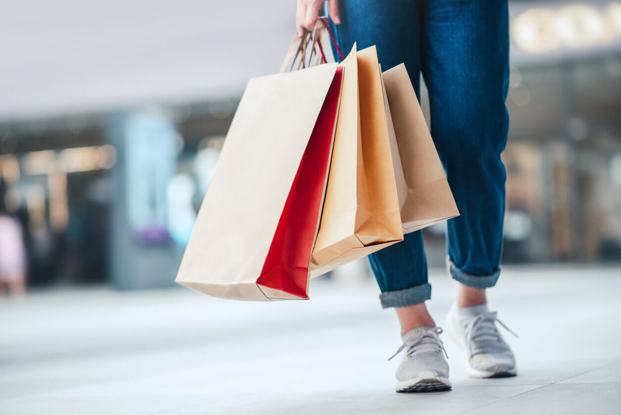 woman holding shopping bags