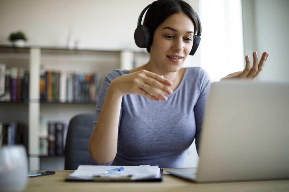 a person on the phone, at their computer, discussing the benefits of an inbound call center