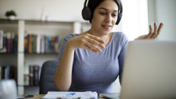 a person on the phone, at their computer, discussing the benefits of an inbound call center