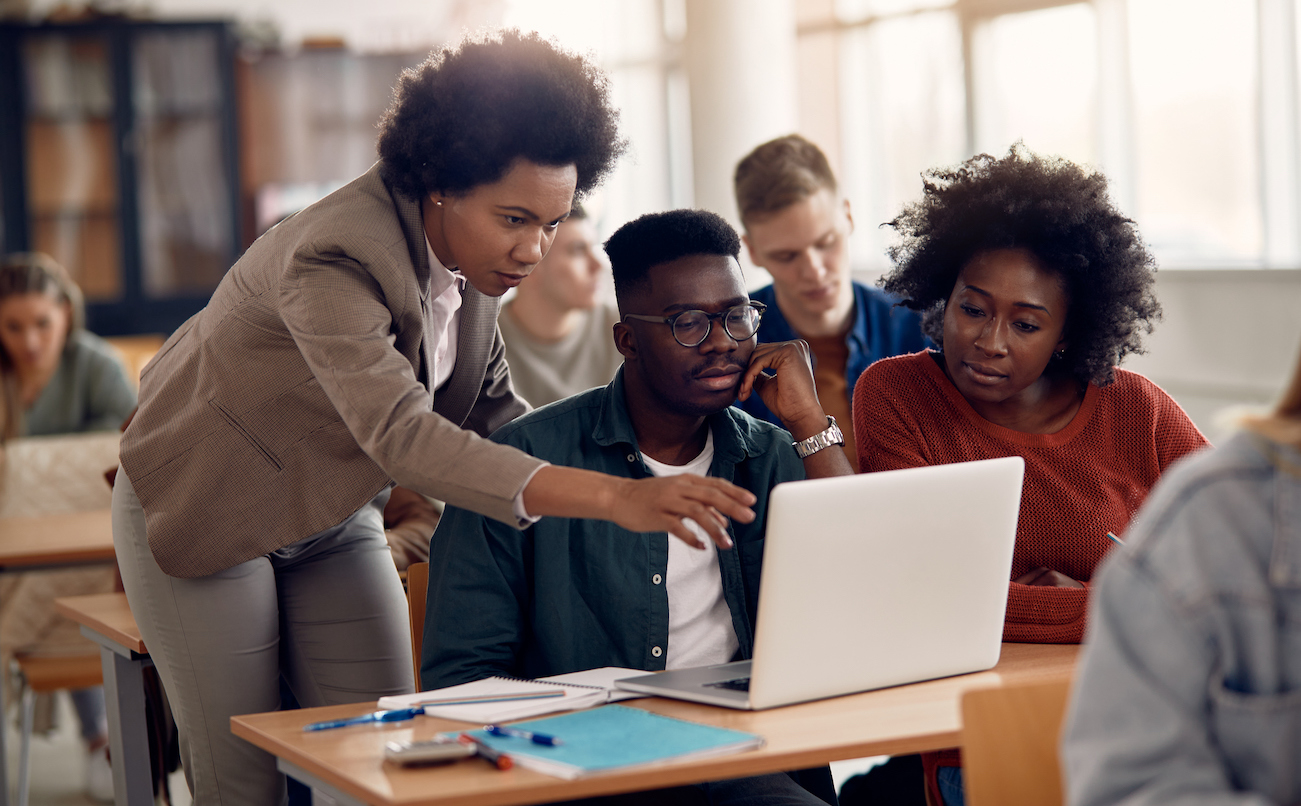 students at a laptop interacting with an education contact center