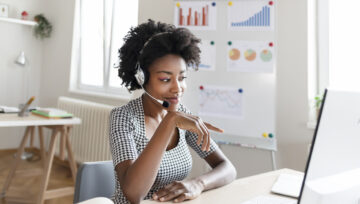 a call center employee working from home, implementing some critical call center skills