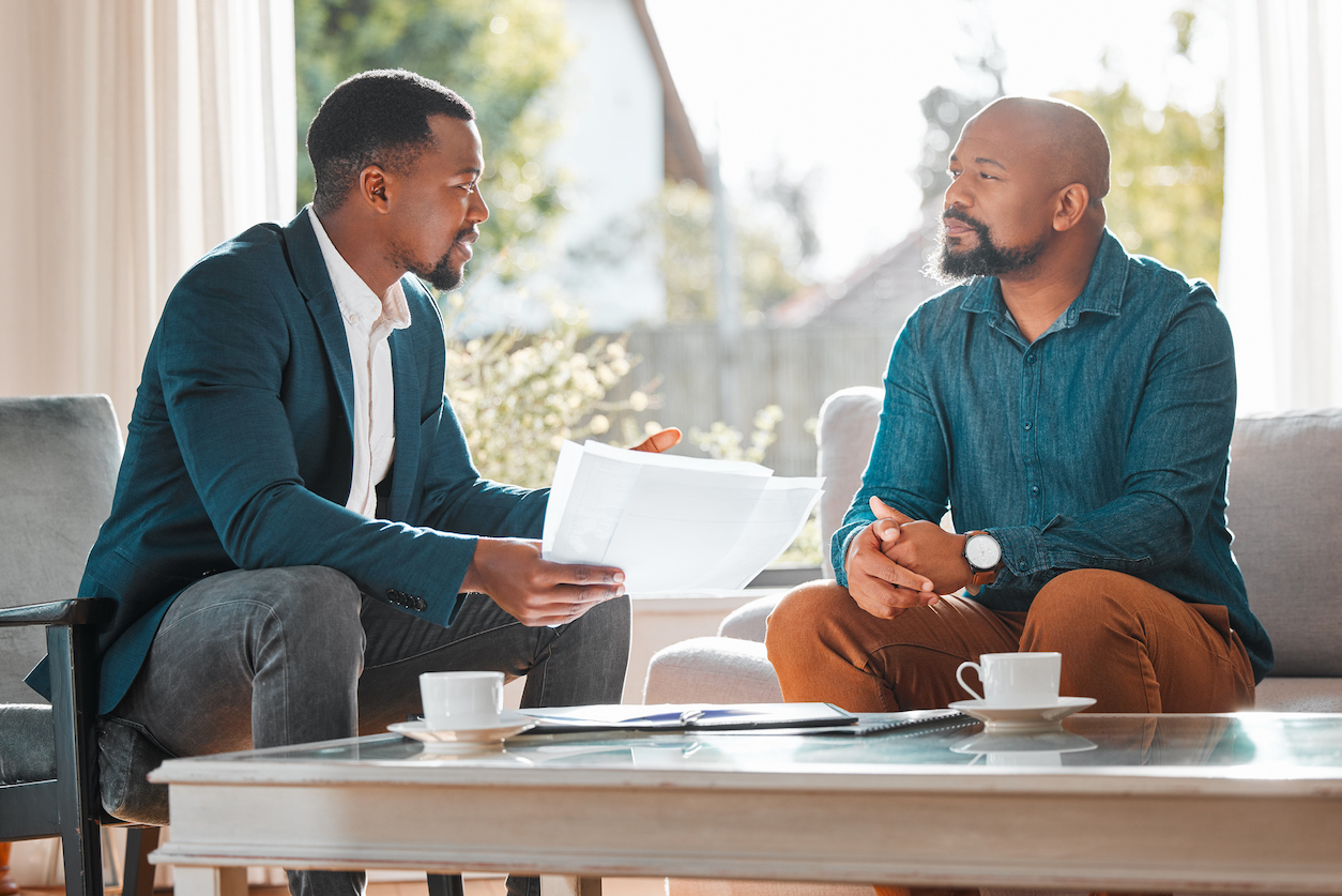 colleagues discussing ways to improve customer experience while sitting on a couch