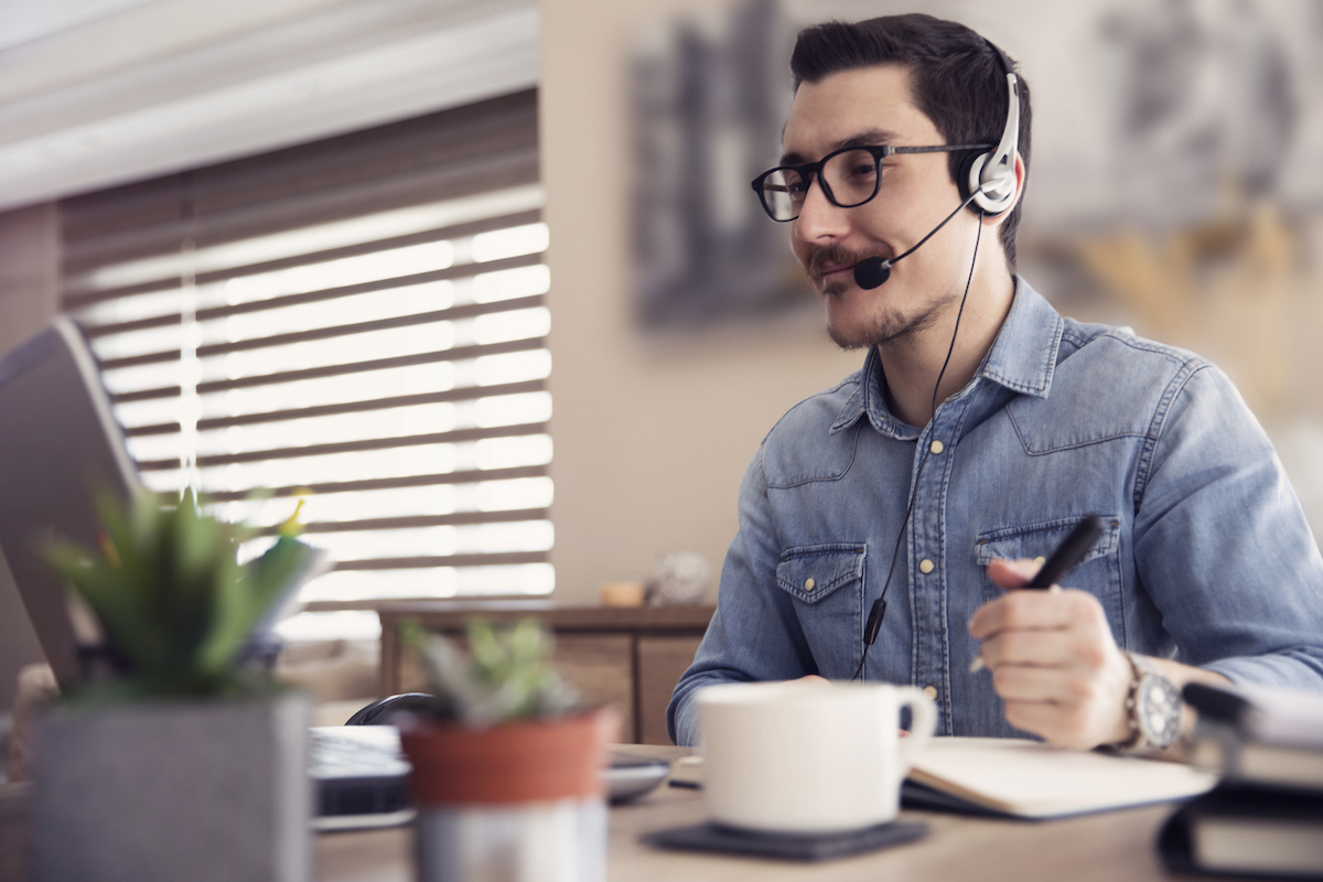 a blended call center agent working at their desk