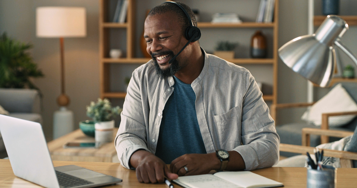 a person at their computer researching workforce management in a call center