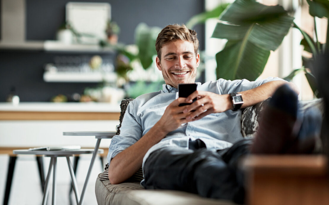 a customer looking happy after interacting with a call center who understands branding