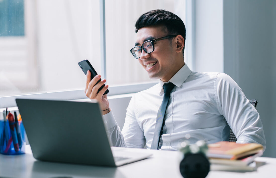 Philippines call center agent looking at a phone