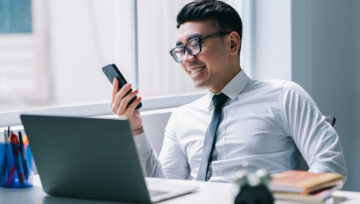 Philippines call center agent looking at a phone