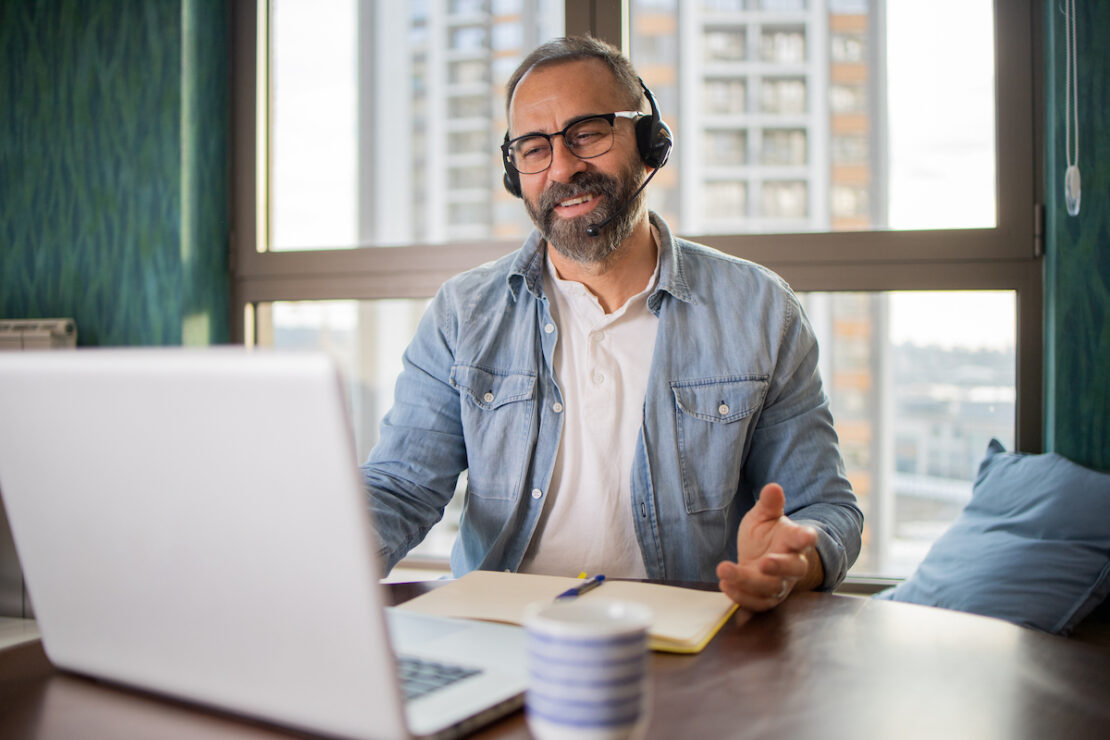 a person at their computer researching call center providers