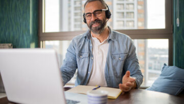 a person at their computer researching call center providers