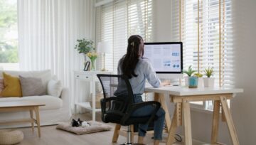 a business owner researching the latest outsourcing trends while working from home