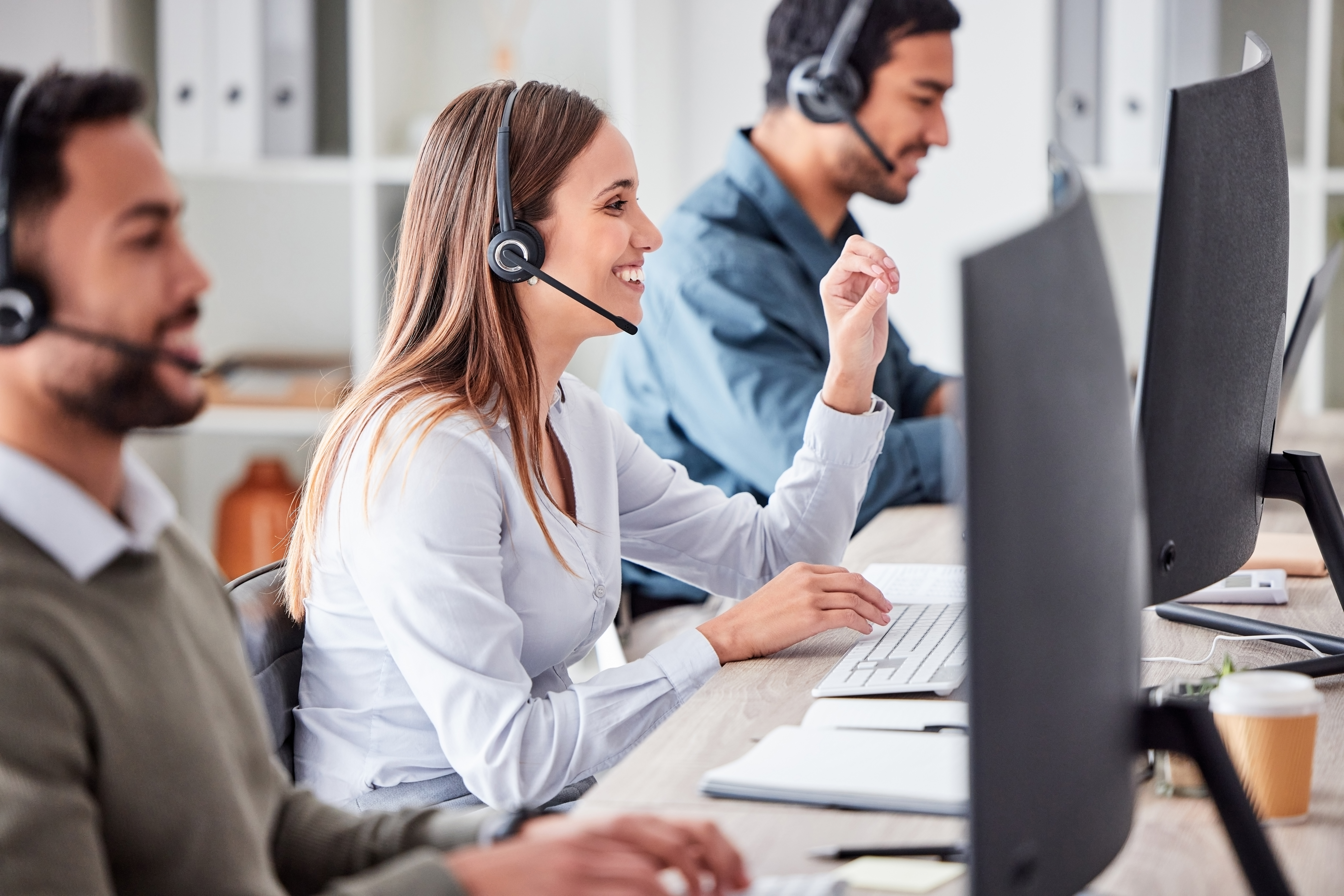 A call center customer service team diligently works towards their customer service goals by creating an excellent customer experience.