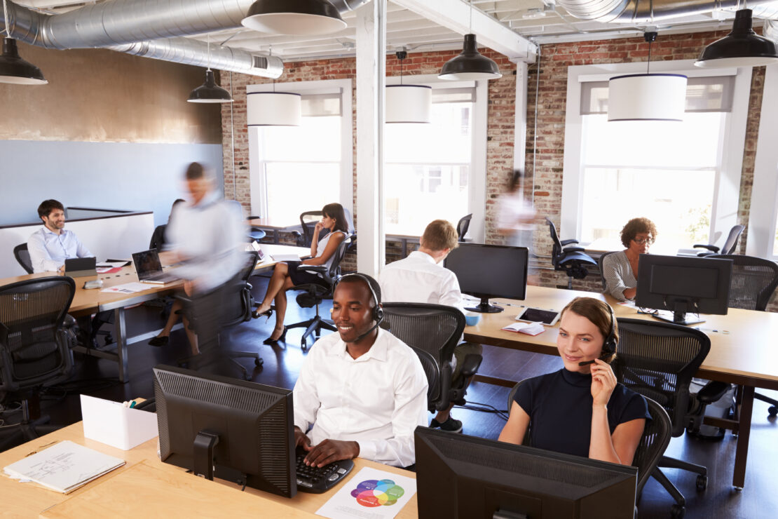A group of busy workers on the phone in the office