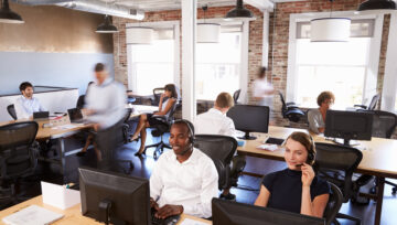 A group of busy workers on the phone in the office