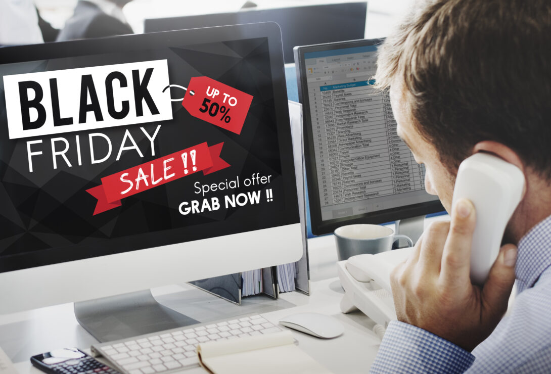 Customer service agent looking at Black Friday sale on computer