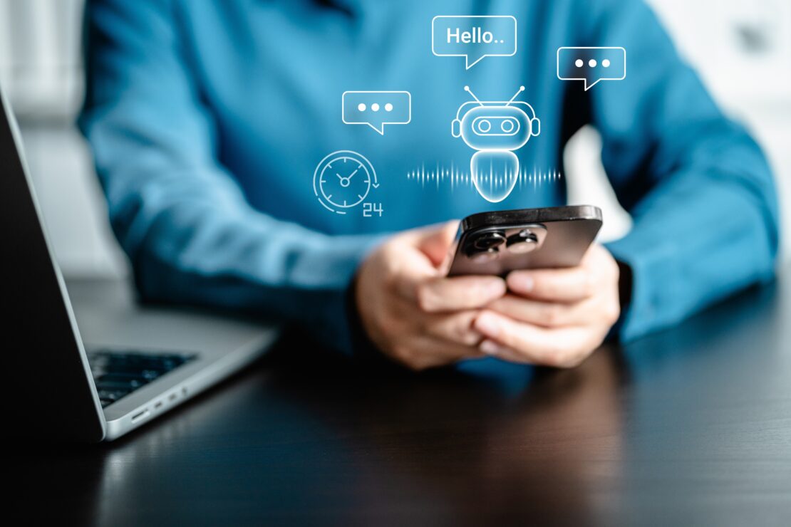 A person using a smartphone to communicate with an AI chatbot.