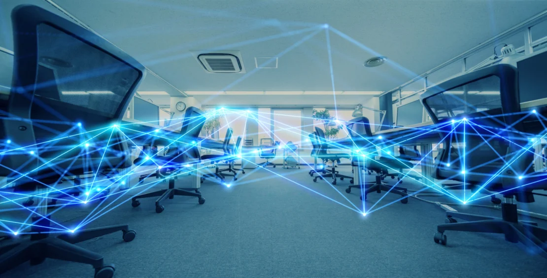 A modern-looking contact center with a network of blue lights superimposed to symbolize its modern tech and connectedness.