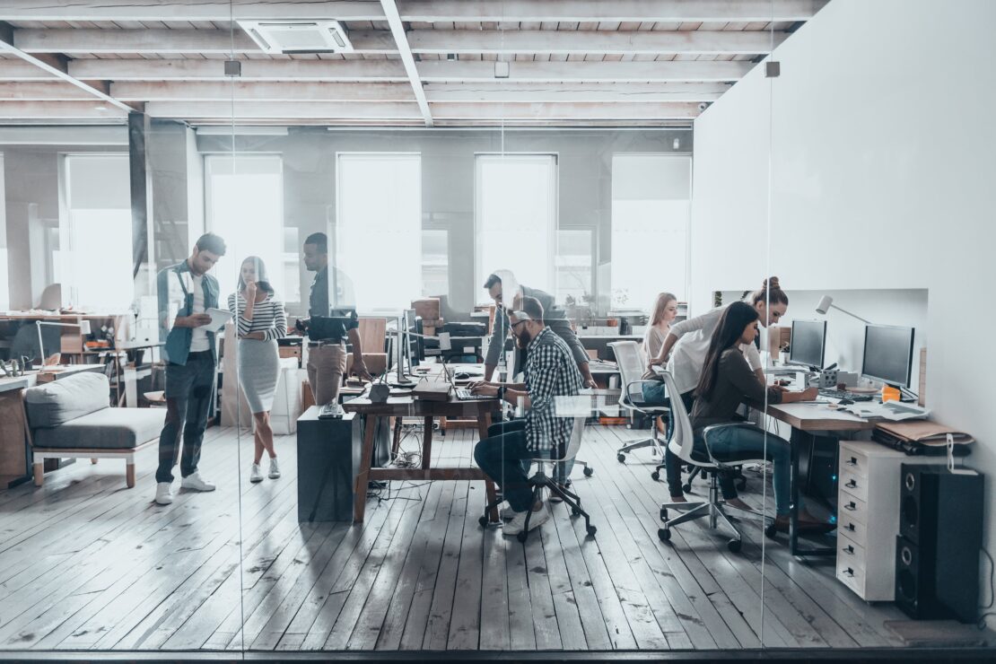 modern office with employees working at desks