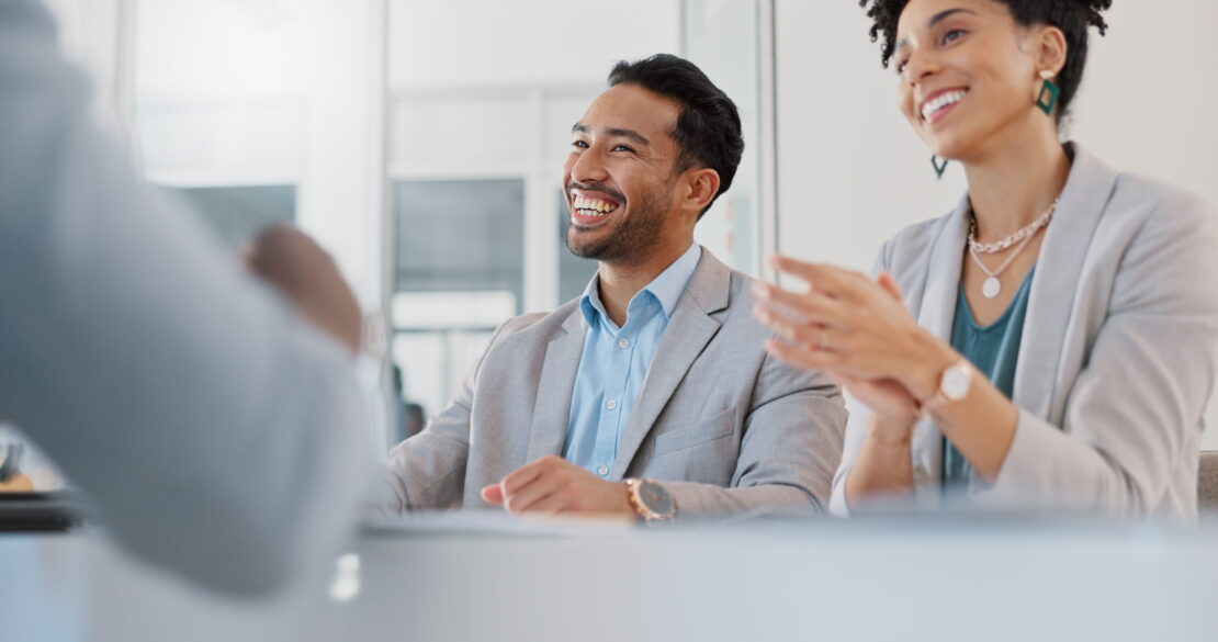 co workers laughing in an office