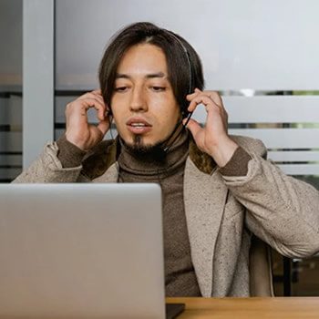 a call center outsourcing agent adjusting their headset.