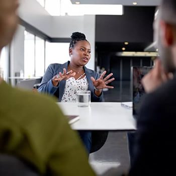 a call center outsourcing team member presenting to a group