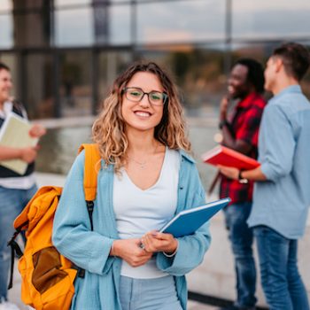 smiling student who had a great experience with an outsourced education contact center