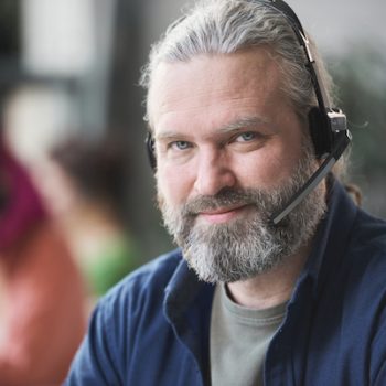a PCI compliant call center agent wearing a headset